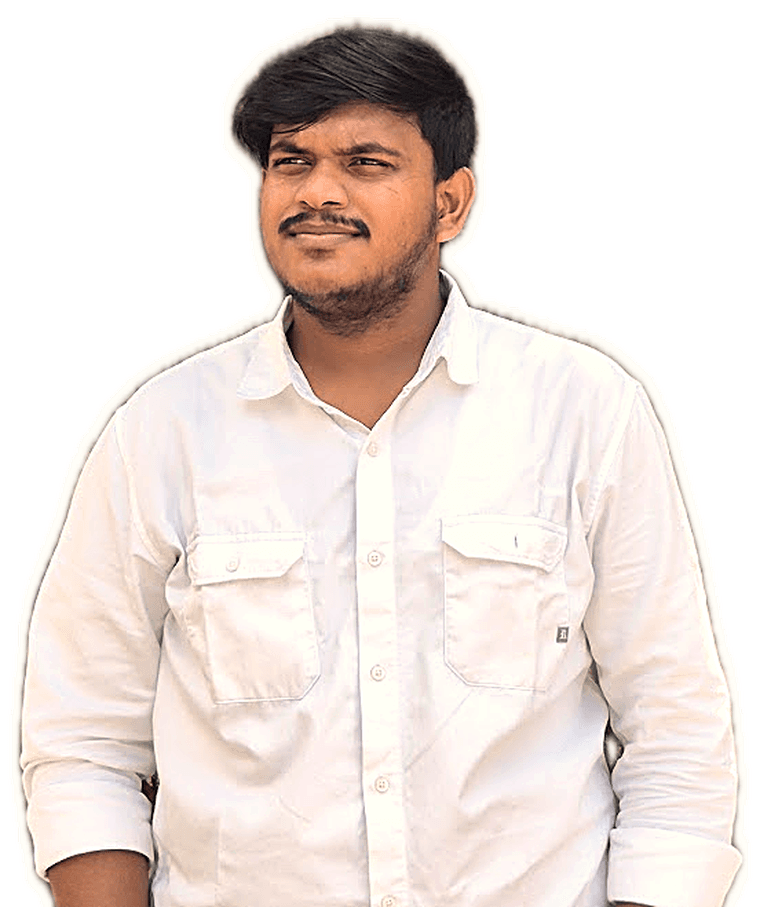Meet Mistry in a white shirt, hands in pockets